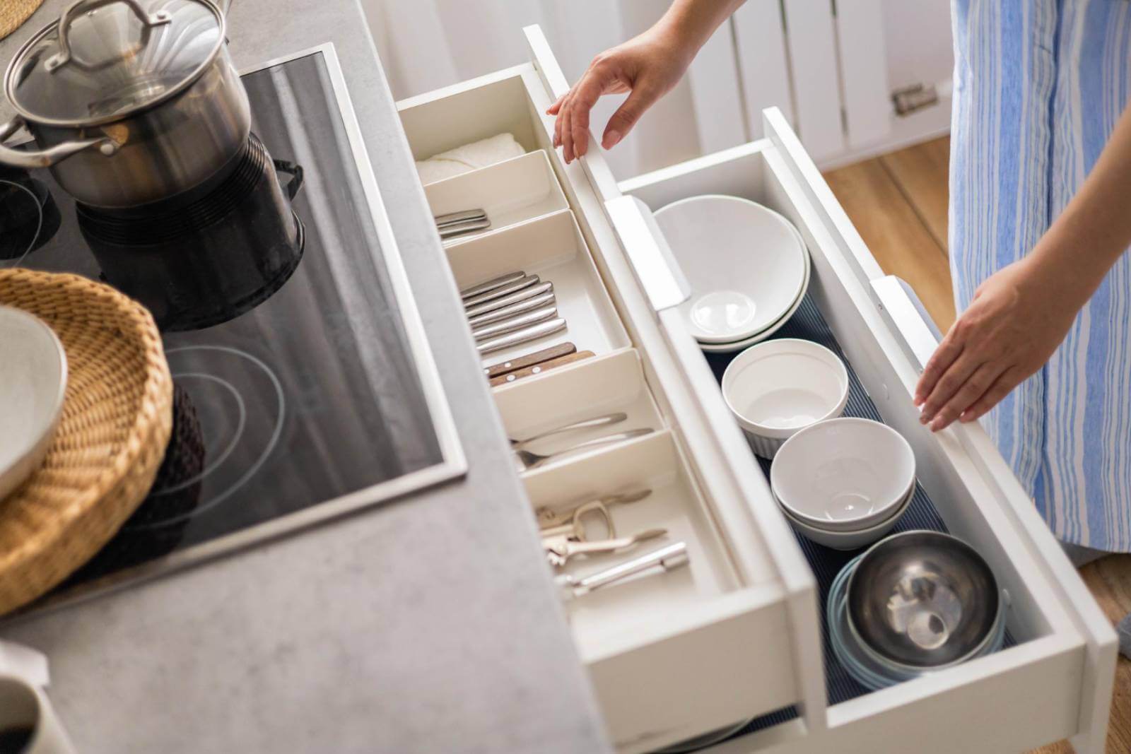 Drawer with plates and dishes in the kitchen remodeling in Los Angeles.