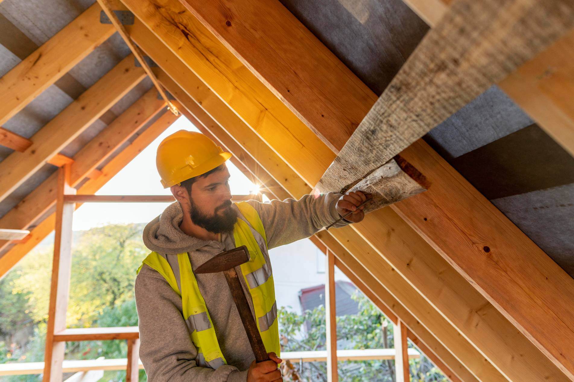 A constructor working on ADU construction and ceiling remodeling.